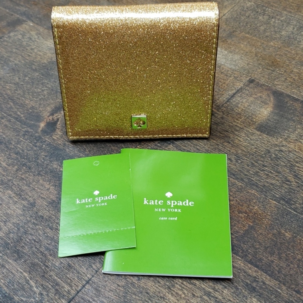 Kate Spade billfold wallet Mavis street gold